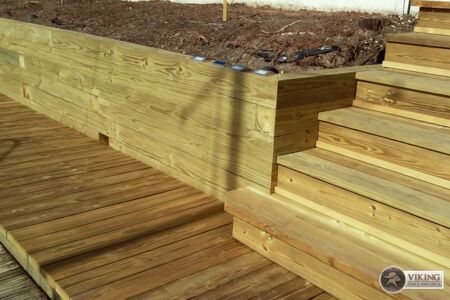 Retaining wall with deck and staircase