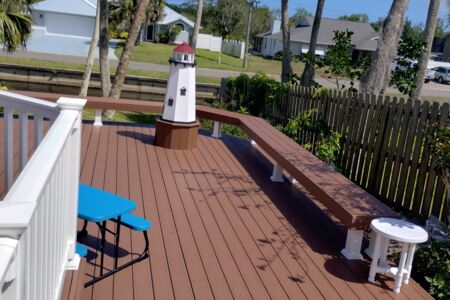 Moisture shield composite deck with white vinyl rail