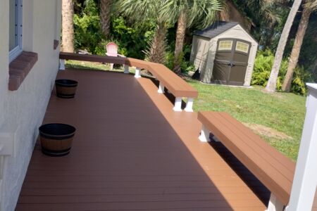 Moisture shield composite deck with white vinyl rail