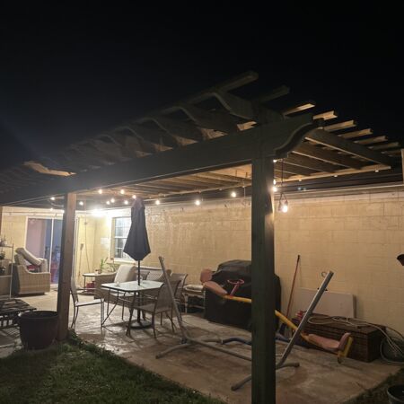 pergola on back of light colored house